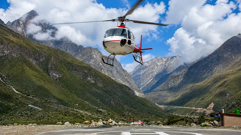 Helicopter landing at Adi Kailash helipad during Himalayan pilgrimage