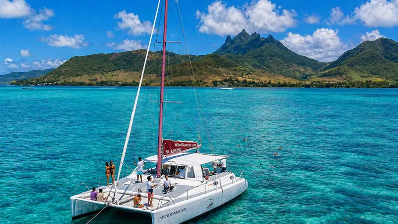 Catamaran sailing across the turquoise lagoon in Mauritius