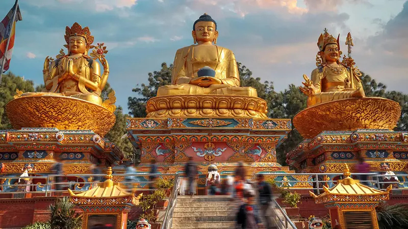Golden Buddha statues and colorful monastery courtyard in Nepal