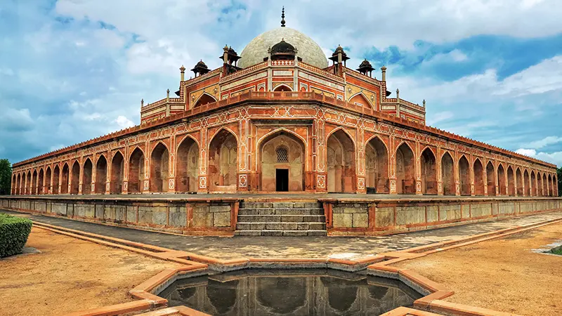 Magnificent Mughal mausoleum with symmetrical arches and heritage gardens