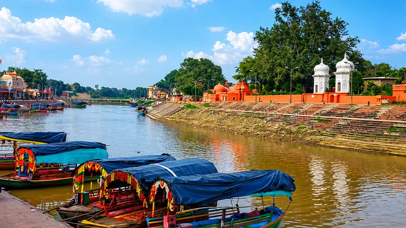 Traditional boats anchored along a historic waterway frequented by pilgrims