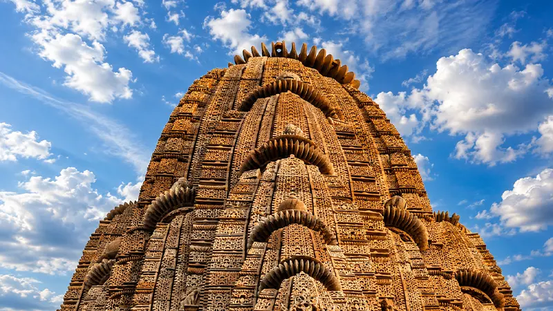 Towering stone shikhara adorned with intricate carvings and sculptural details