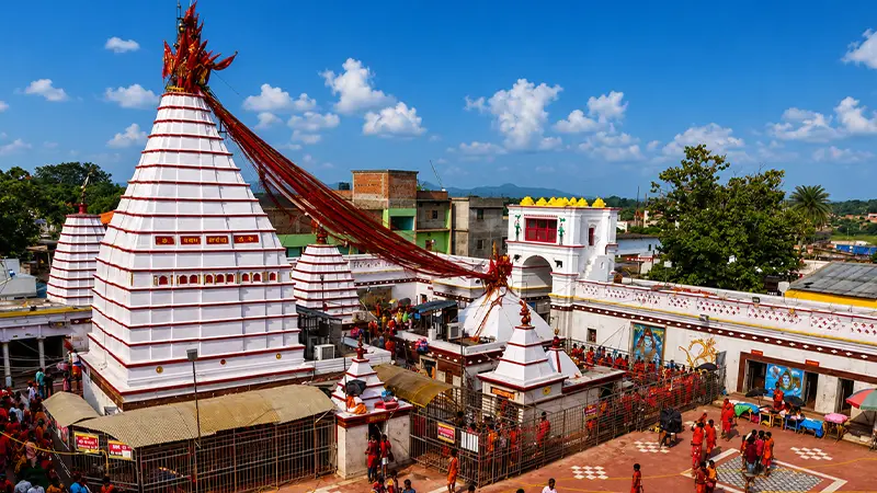 Kamakhya temple complex with white domes and red ceremonial cloth in Guwahati