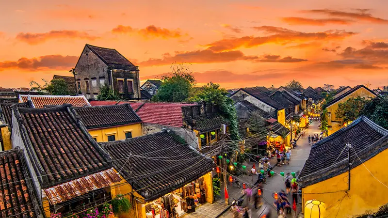 Traditional heritage town streets glowing with lanterns at sunset