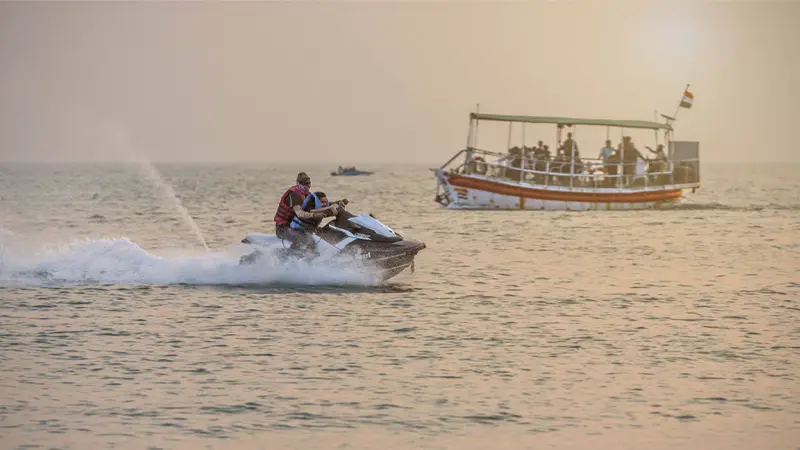 Tourist enjoying an exciting jet ski ride at Mandvi Beach in Gujarat