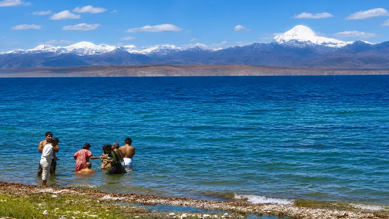 Devotees taking a holy dip in the sacred waters of Lake Mansarovar