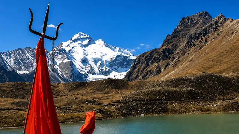 Sacred lake with Om Parvat peaks in the background