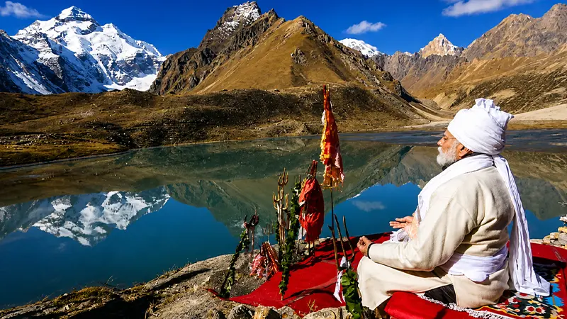 Pilgrim meditating beside Parvati Sarovar near Adi Kailash