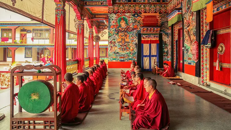 Buddhist monks praying inside Rumtek Monastery Sikkim