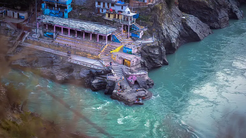 Devotional gathering place situated beside a sacred riverbank