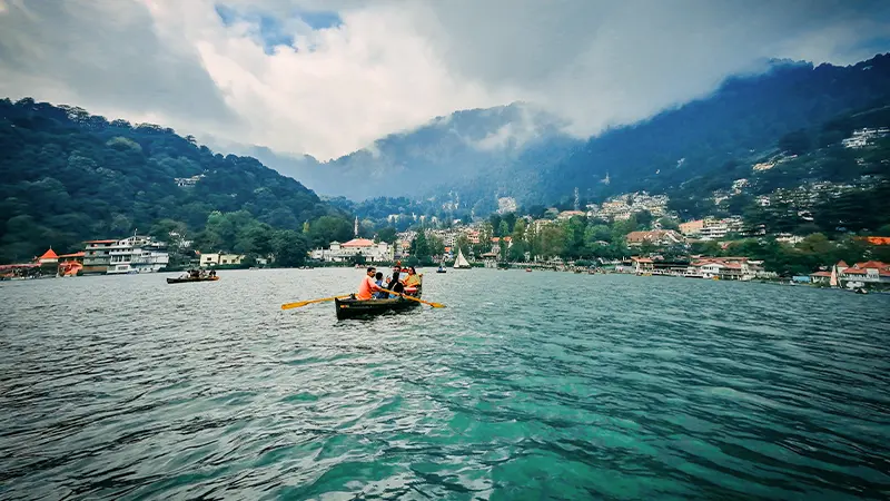 Tourists enjoying boating on a picturesque mountain lake