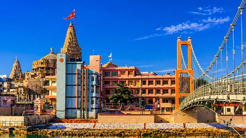 Sudama Setu suspension bridge with Dwarkadhish Temple in the background