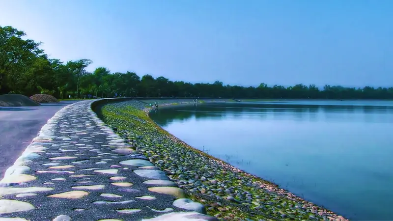 Peaceful walkway along the banks of Sukhna Lake Chandigarh