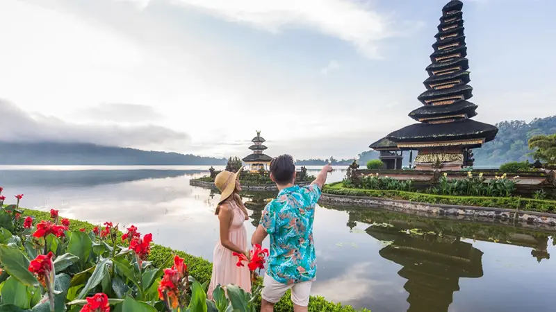 Couple admiring Ulun Danu Beratan Temple on a romantic Bali getaway