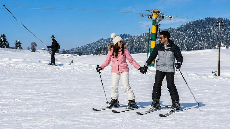 Couple enjoying a memorable winter holiday in a snowy mountain destination