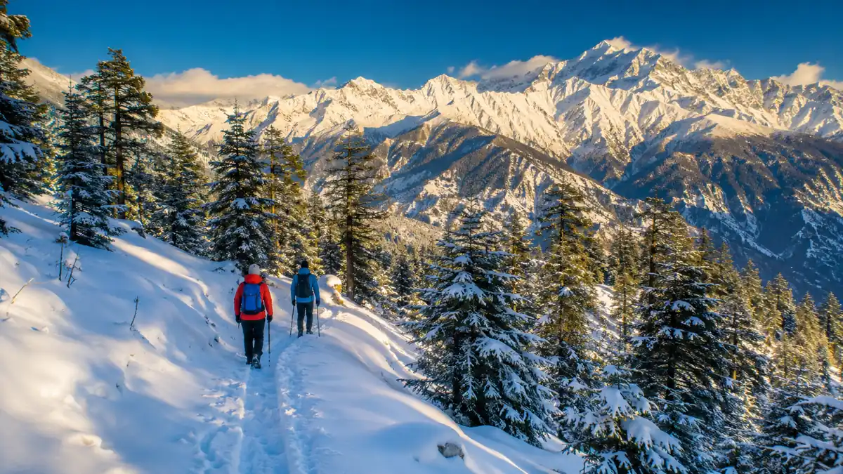 Trekkers on the snow-covered Kedarkantha Trek in Uttarakhand