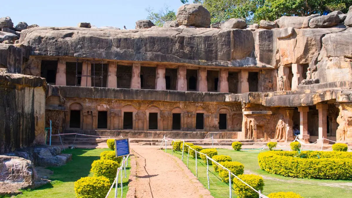 Historic cave monastery courtyard surrounded by rock-cut chambers