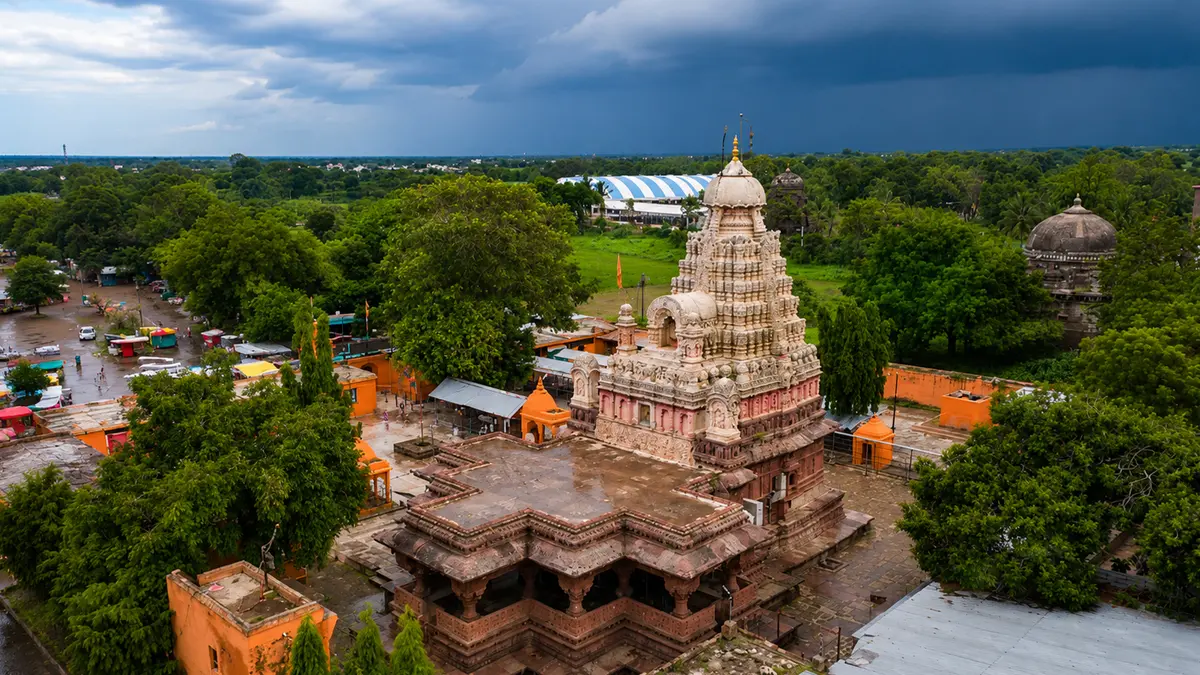 Ancient stone sanctuary surrounded by greenery showcasing rich cultural and spiritual heritage