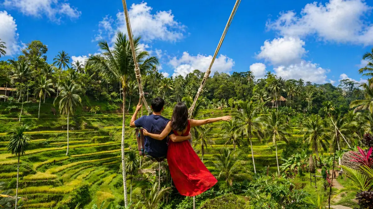 Family enjoying the famous jungle swing over Bali rice terraces