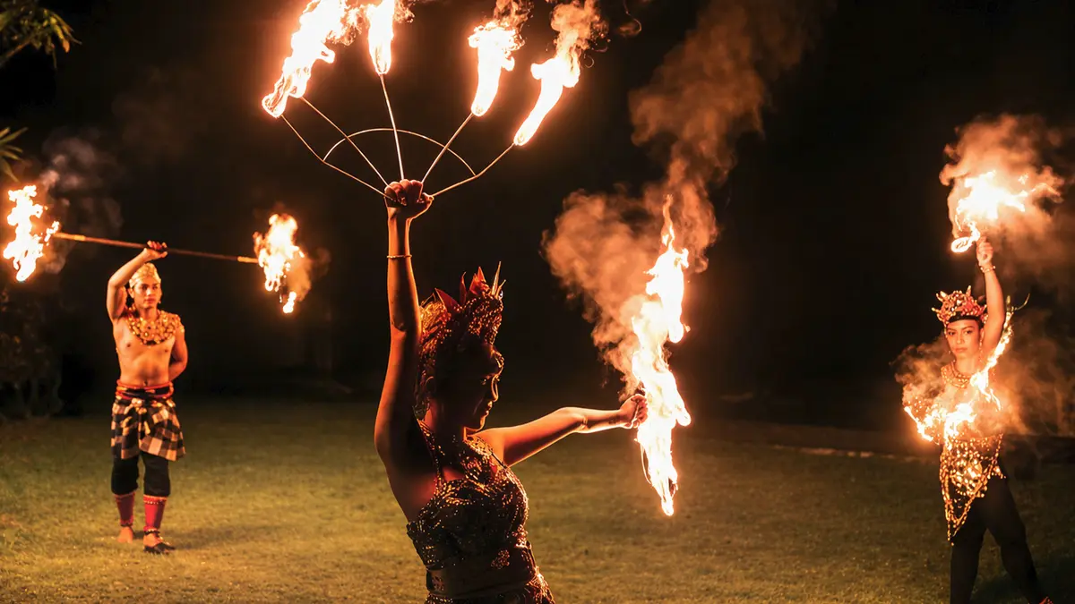 Traditional Balinese fire dance performance showcasing local culture during an evening show