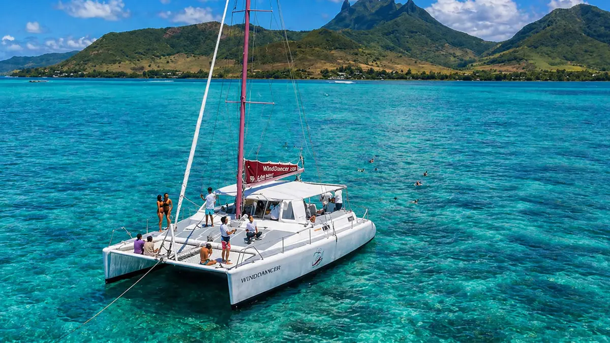Catamaran sailing across the turquoise lagoon in Mauritius