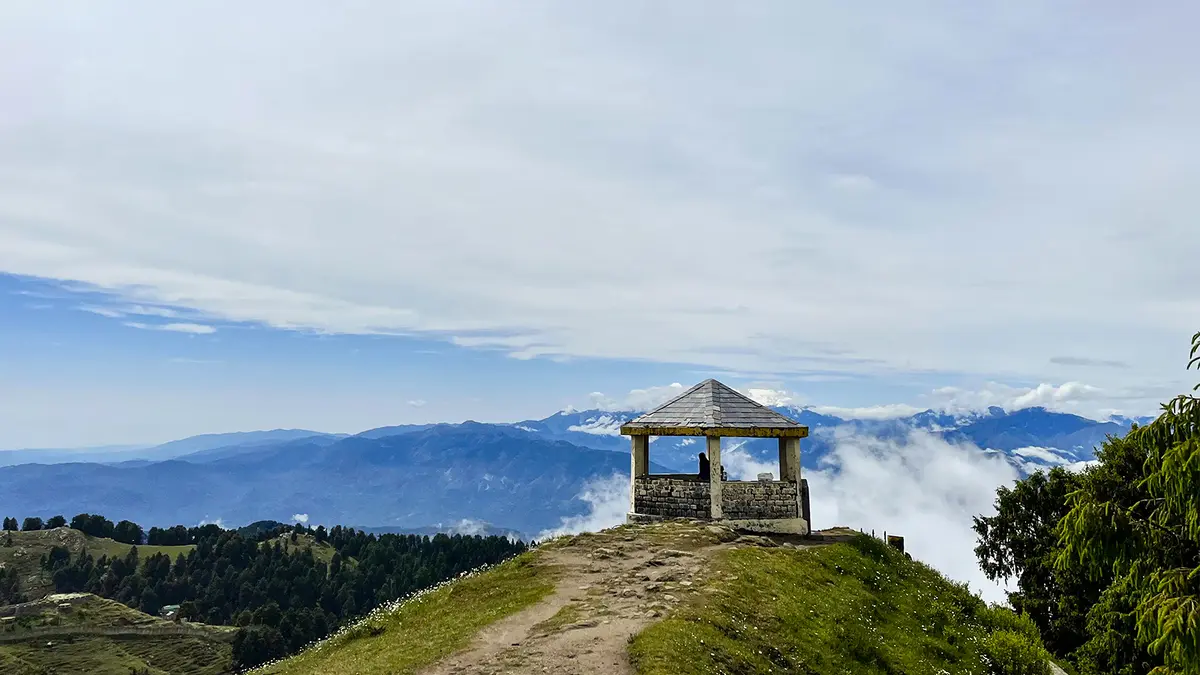 Hilltop viewpoint at Dainkund Peak offering breathtaking valley views near Dalhousie