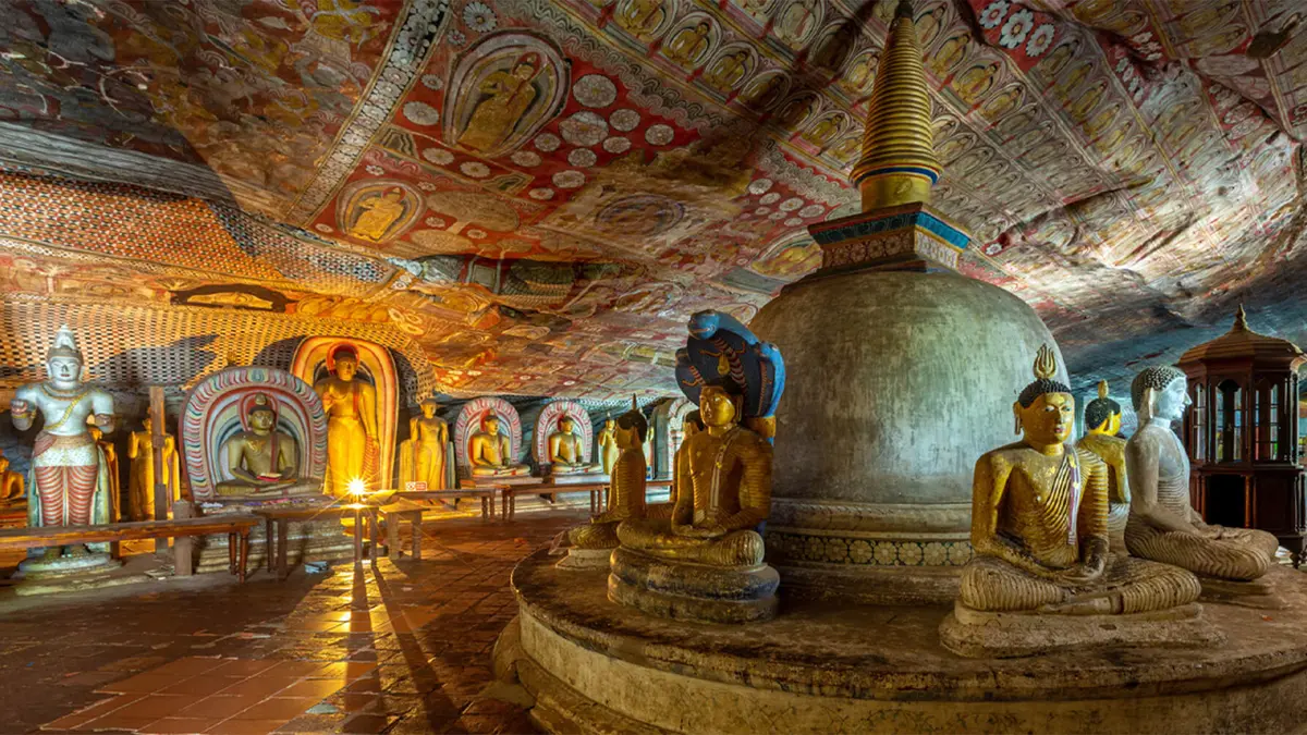 Ancient Buddhist murals and shrine inside Dambulla Cave Temple