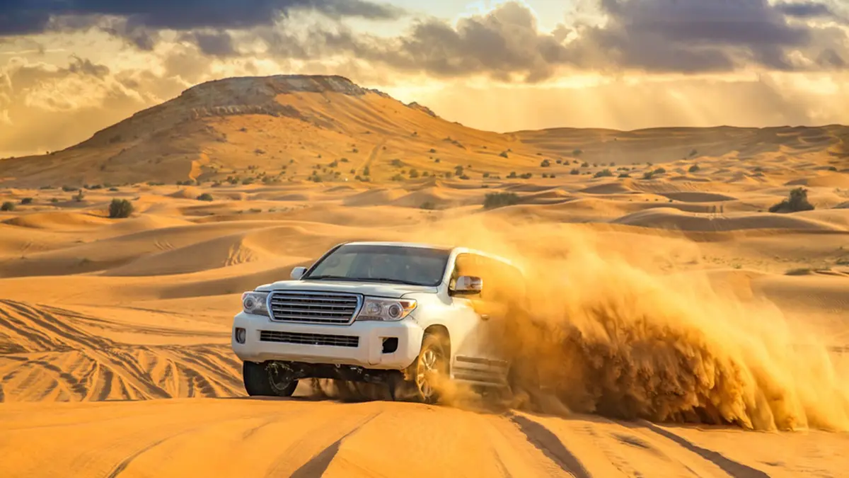 4x4 vehicle enjoying an exciting dune bashing adventure in the Dubai desert