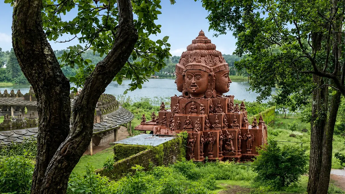 Multi-faced Dattatreya sculpture overlooking the Narmada riverside landscape