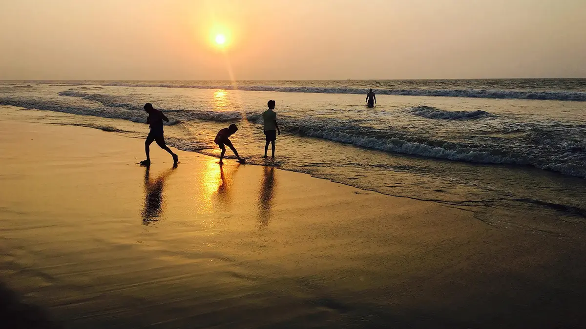 Families enjoying leisure activities along a scenic seaside destination