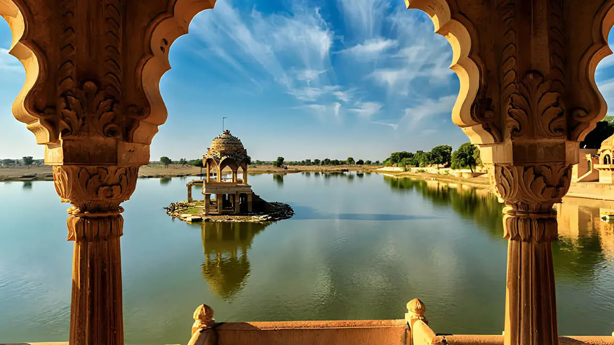 Historic pavilion and tranquil waters of Gadisar Lake in Jaisalmer