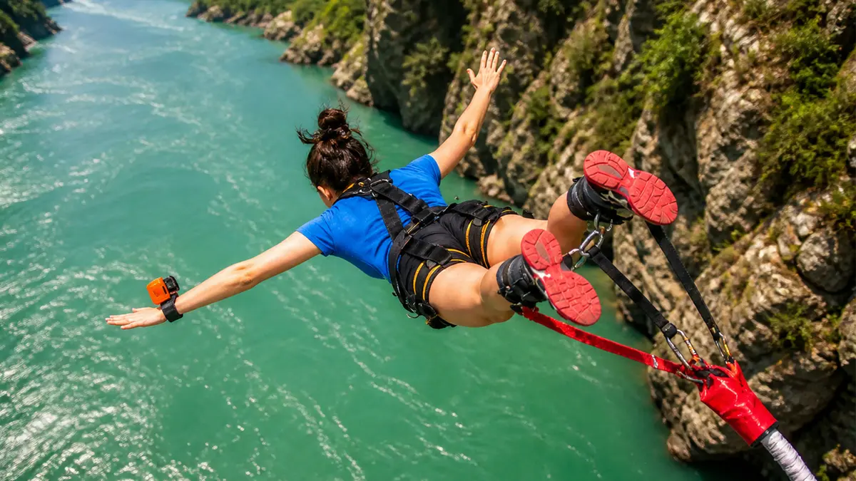 Thrilling bungee jump over the Ganga River in Rishikesh with scenic mountain views