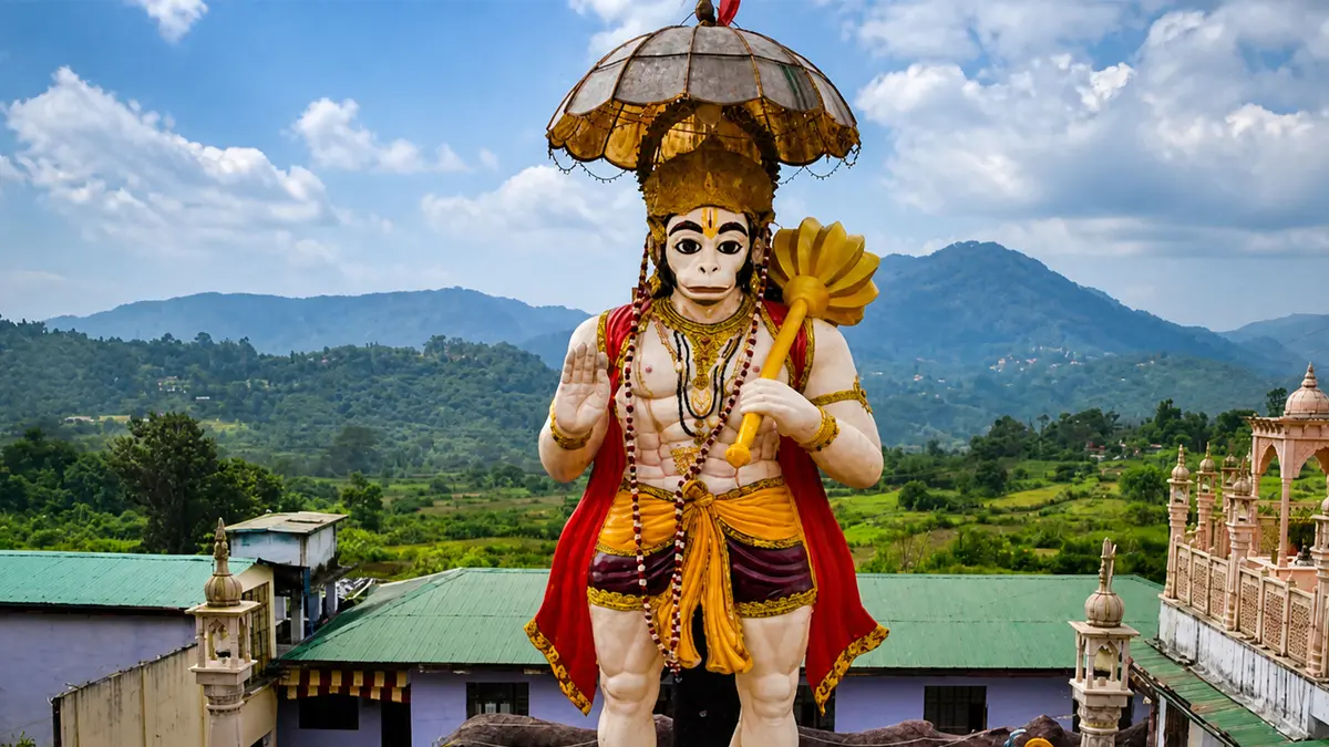 Sacred guardian deity statue overlooking green Himalayan landscapes