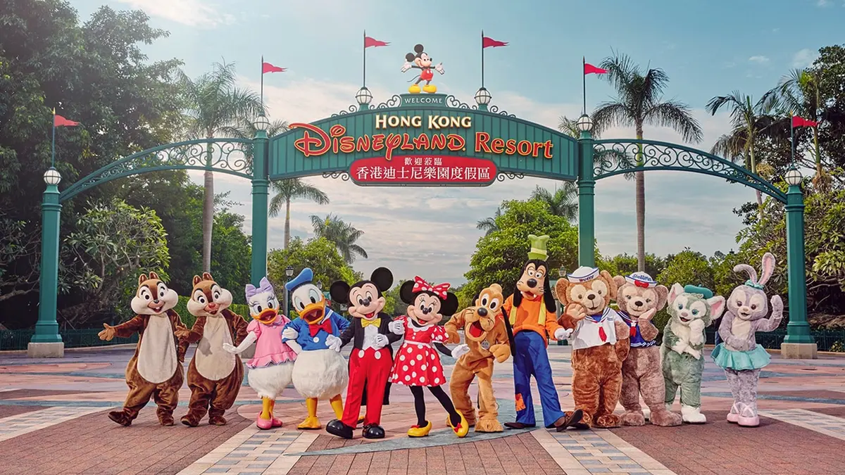 Visitors posing with Disney characters at Hong Kong Disneyland Resort entrance