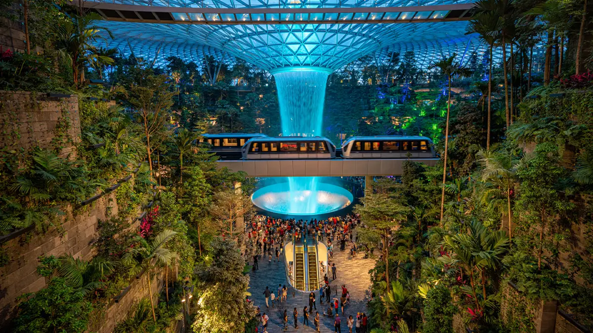 HSBC Rain Vortex inside Jewel Changi Airport surrounded by lush indoor gardens