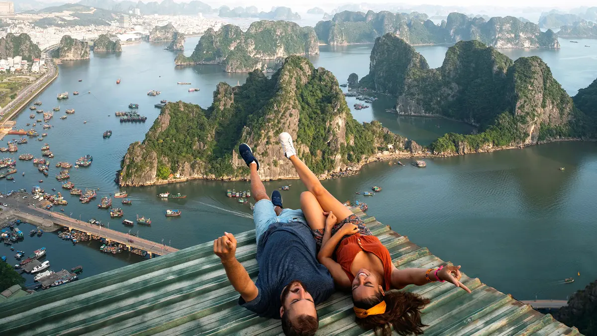 Travelers enjoying panoramic views of limestone islands and turquoise bay waters