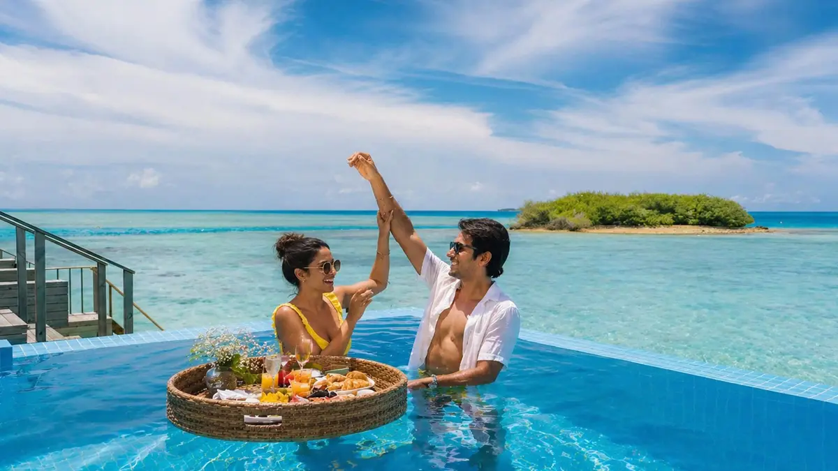 Couple enjoying an infinity pool at a Maldives luxury resort