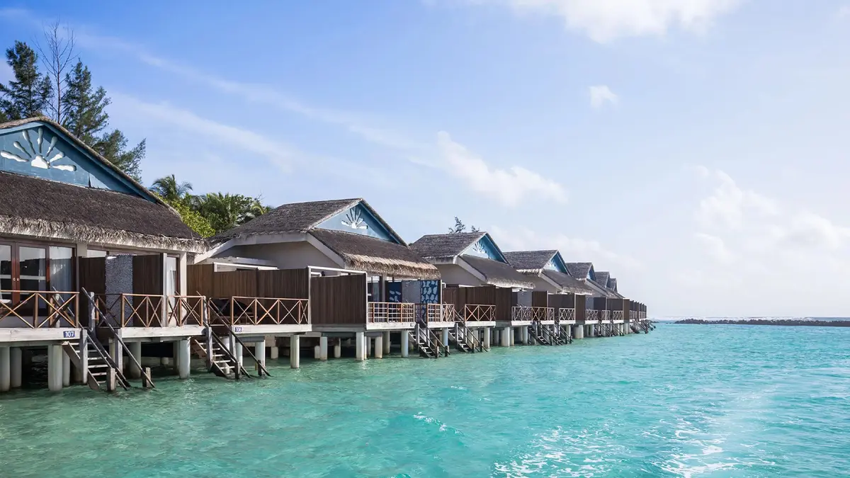 Luxury overwater villas overlooking the turquoise lagoon in the Maldives