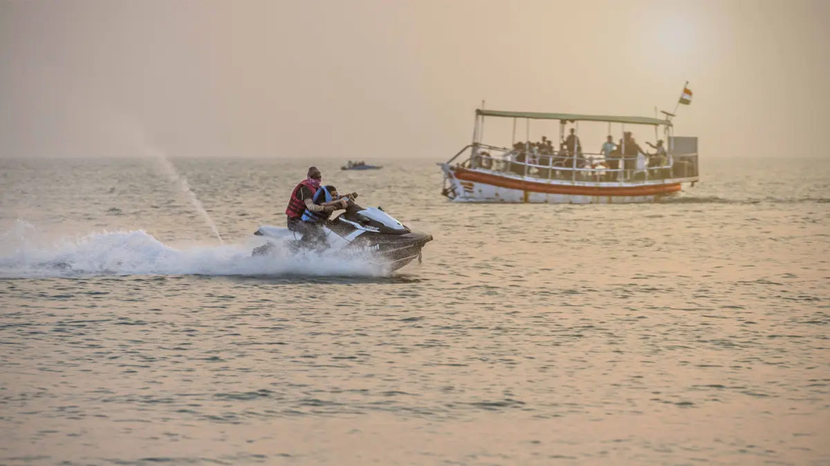 Tourist enjoying an exciting jet ski ride at Mandvi Beach in Gujarat