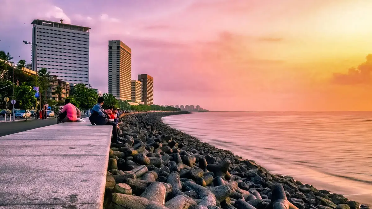 Visitors enjoying the sunset along Mumbai's iconic Marine Drive promenade