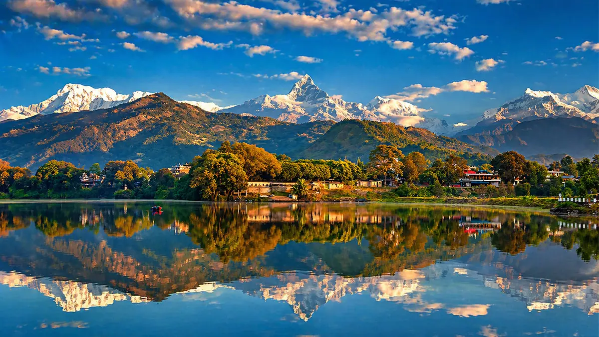 Annapurna mountain range reflected in Phewa Lake near Pokhara, Nepal