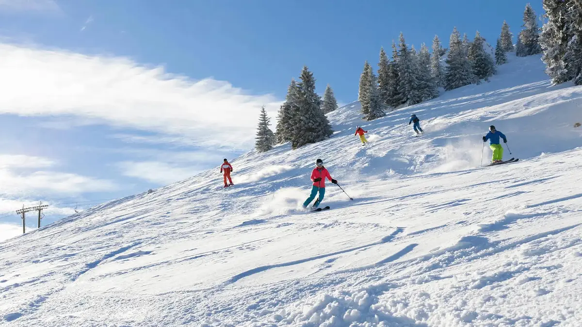 Visitors enjoying winter recreation on pristine snow-covered slopes
