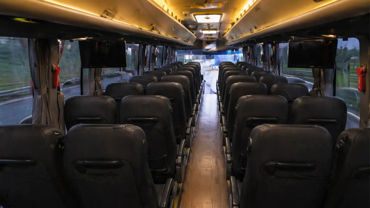 Spacious premium tour bus interior with comfortable reclining seats for long-distance travel
