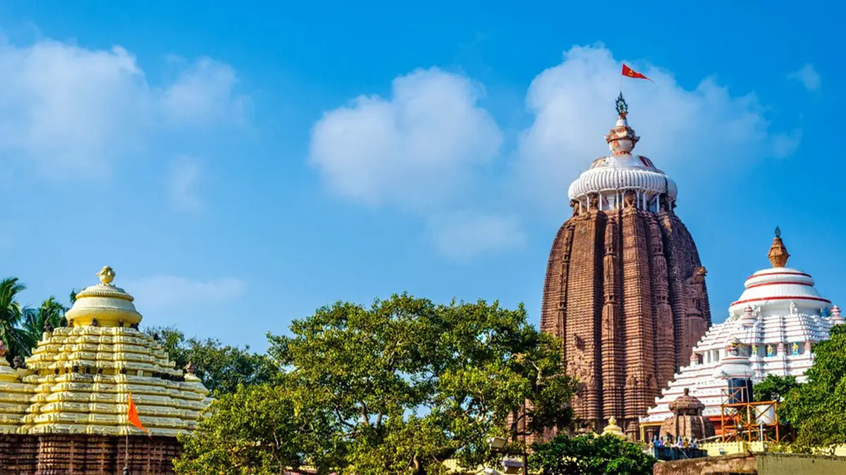 Prominent sanctuary skyline rising above lush greenery and sacred grounds