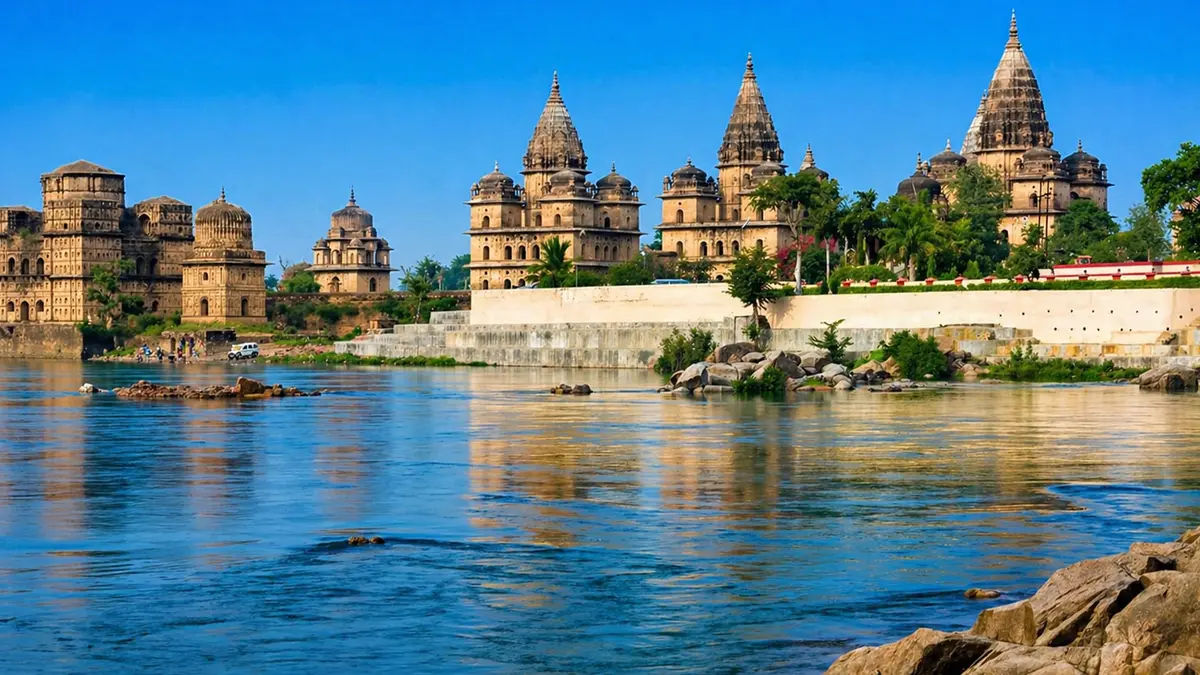 Historic palace and temple structures lining a scenic riverbank
