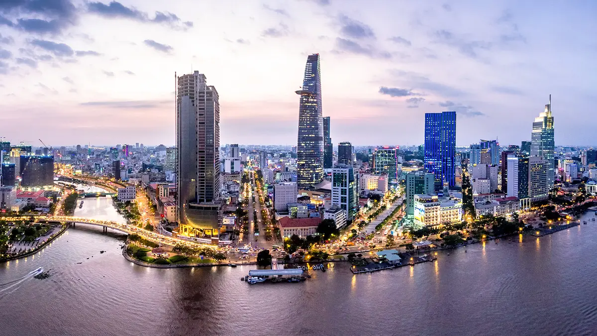 Modern riverside skyline illuminated during evening twilight