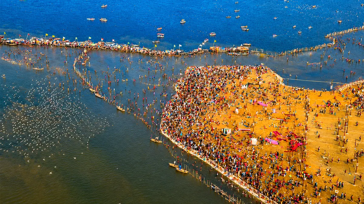 Aerial view of festival grounds at a sacred confluence attracting thousands of pilgrims