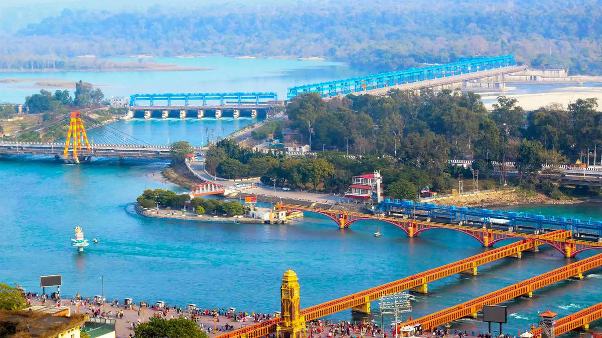 Aerial view of a sacred river confluence and pilgrimage gathering area