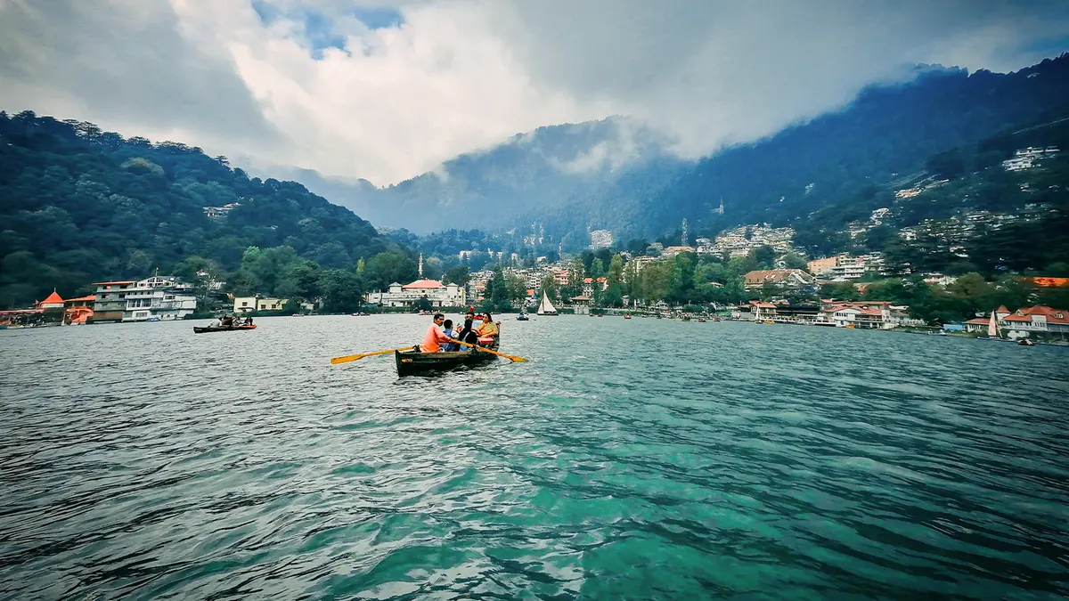 Tourists enjoying boating on a picturesque mountain lake