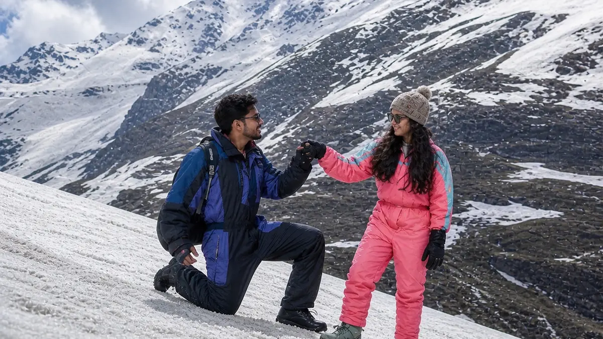 Couple enjoying a romantic snow adventure in the Himalayan mountains